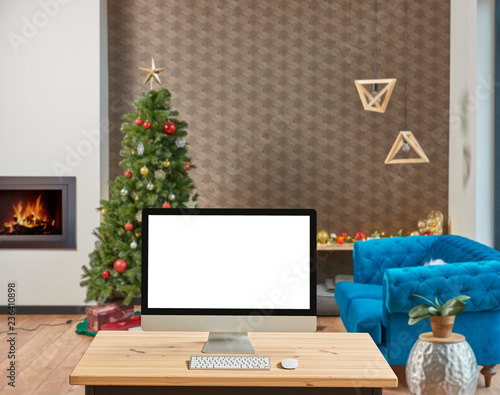 Modern home decoration, Christmas detail blur background, close up desktop screen on the wooden desk.