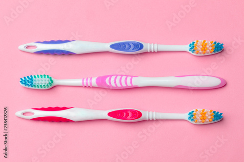 Toothbrushes on pink background