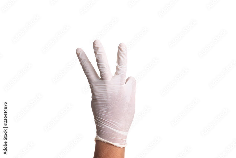 Doctor hand in white latex sterile gloves isolated on white Doctor hand in white latex sterile gloves isolated on white