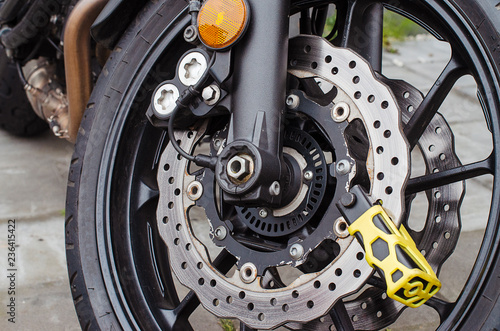 theft protection is mounted on the motorcycle brake disc