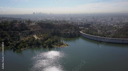aerial shot above hollywood lake and hollywood barrage, downtown Los Angeles in the background