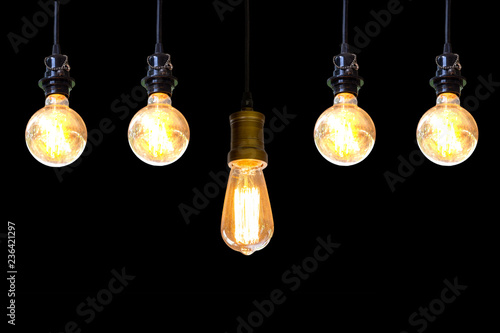 Vintage light bulb hanging over black background, Idea concept.