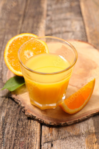 orange juice on wood background