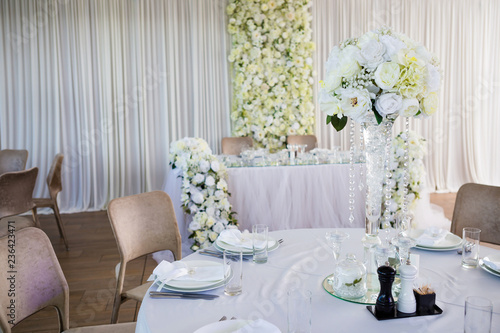 Wedding banquet in restaurant, tables with flowers