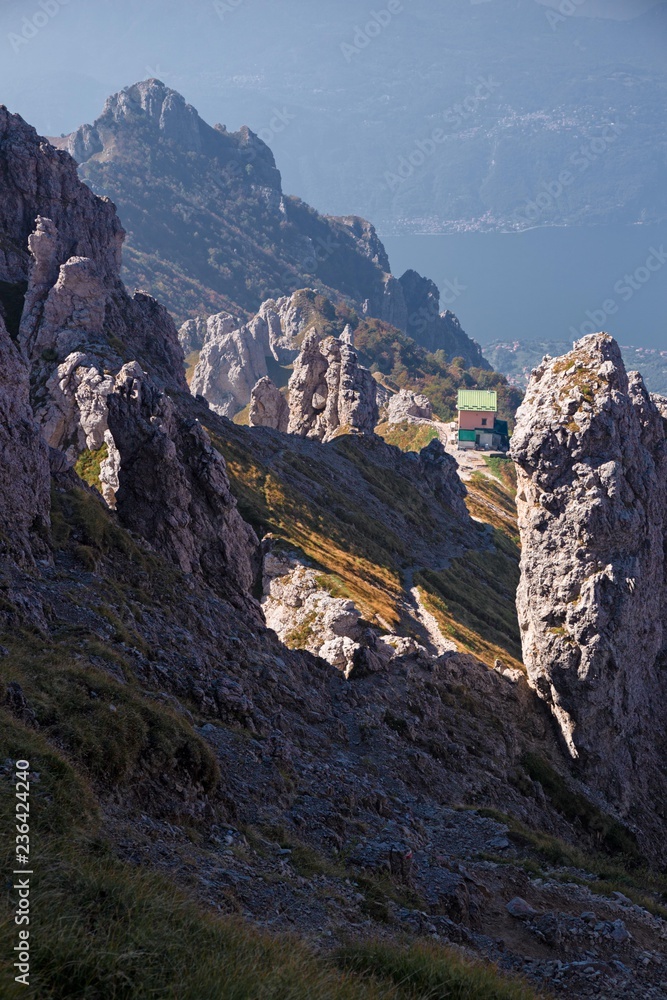 The Rosalba refuge between the towers of the Southern Grigna from the Garibaldi hill.