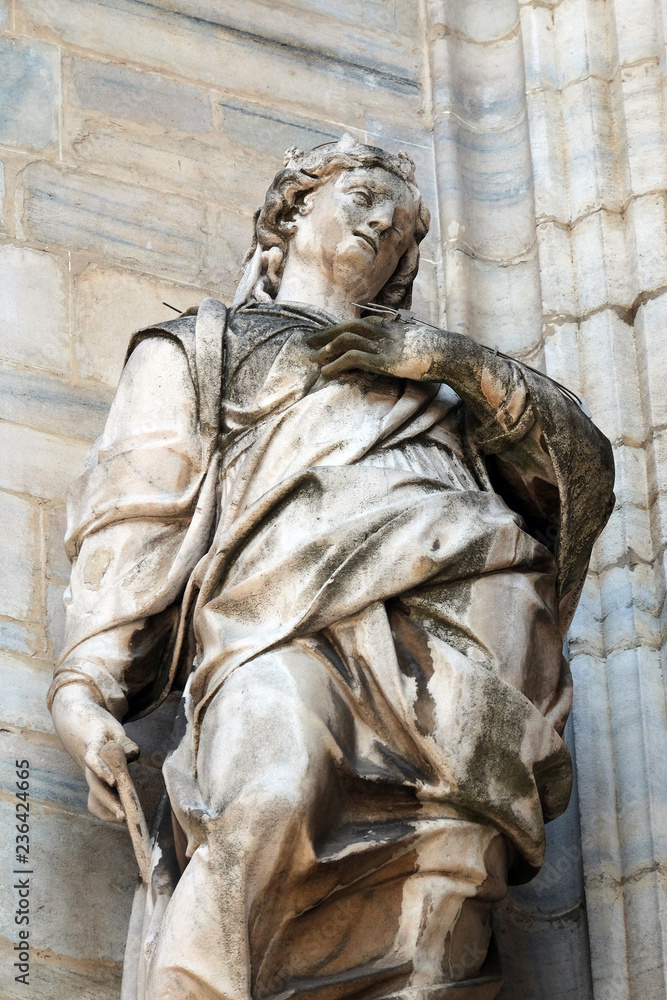 Obraz premium Saint Margaret, known as Margaret of Antioch, statue on the Milan Cathedral, Duomo di Santa Maria Nascente, Milan, Lombardy, Italy