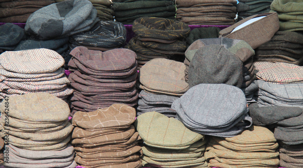 A Collection of Cloth Flat Caps on a Retail Display.
