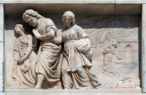 Lot and his daughters flee from Sodom, marble relief on the facade of the Milan Cathedral , Duomo di Santa Maria Nascente, Milan, Lombardy, Italy