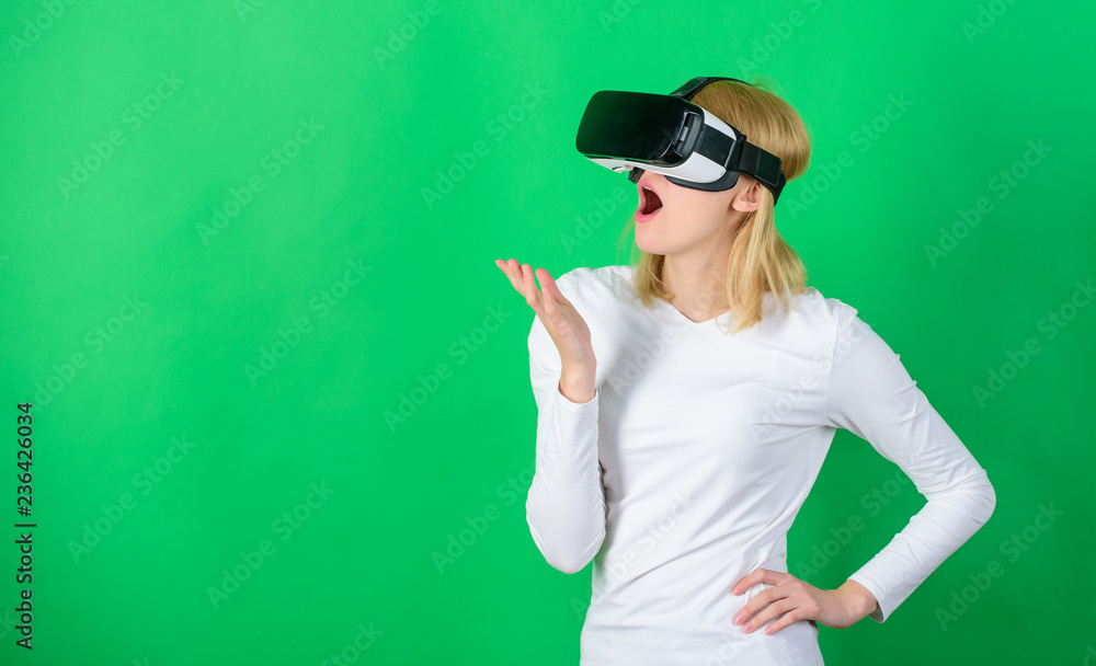 Woman watching virtual reality vision. Excited smiling businesswoman wearing virtual reality glasses. VR game. Woman watching virtual reality vision. Excited smiling businesswoman wearing virtual reality glasses. VR game.