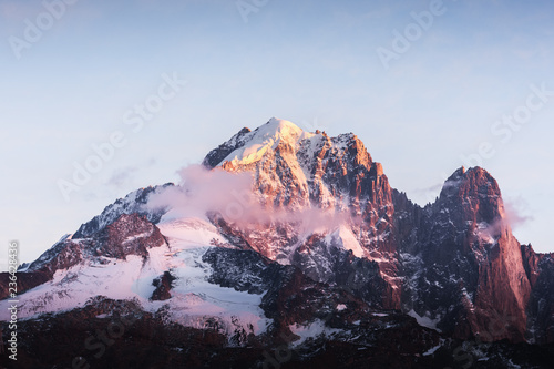 Incredible colorful sunset on Aiguille Verte peak in French Alps. Monte Bianco range, Mont Blank massif, France. Landscape photography