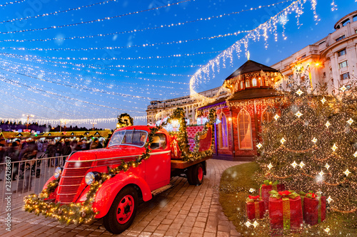 Christmas scene with traditional California historical vehicle in the Market square of Bucharest, Romania