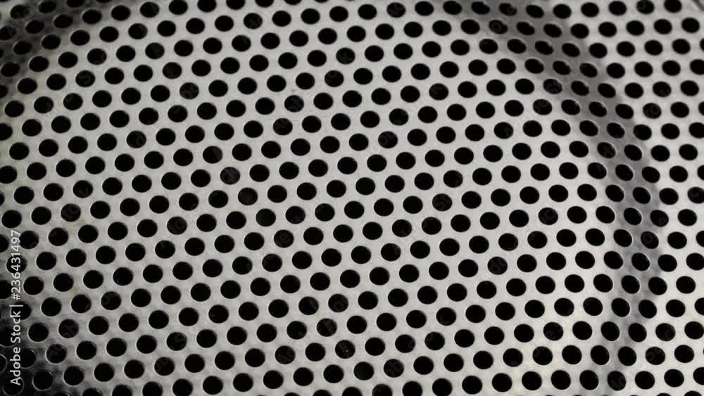 Background with perforated holes.
Background with perforated holes.