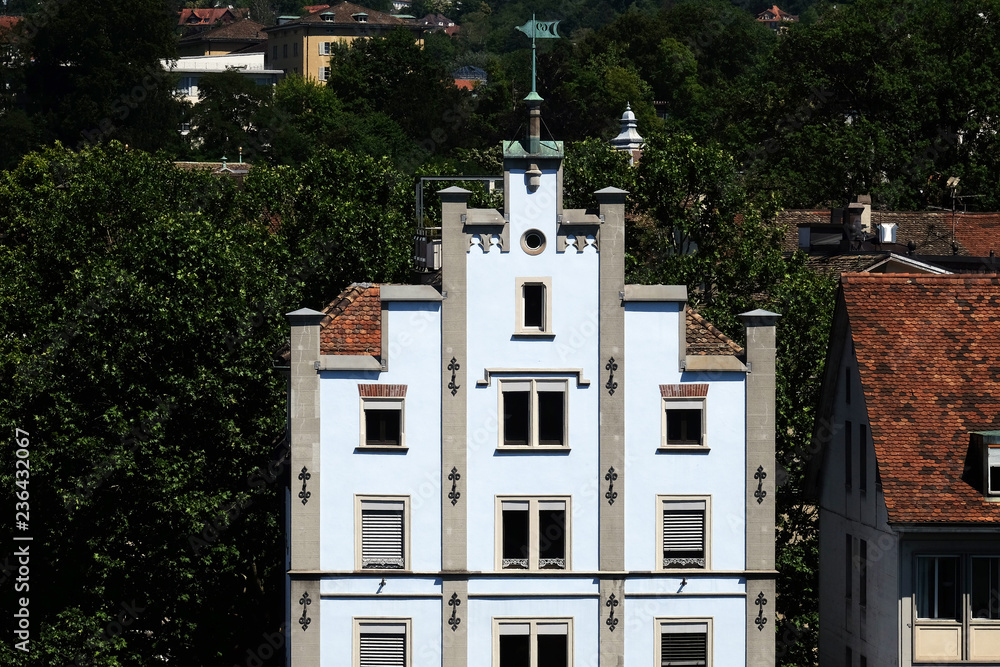 Naklejka premium Typical Swiss white house near river Limmat in Zurich, Switzerland