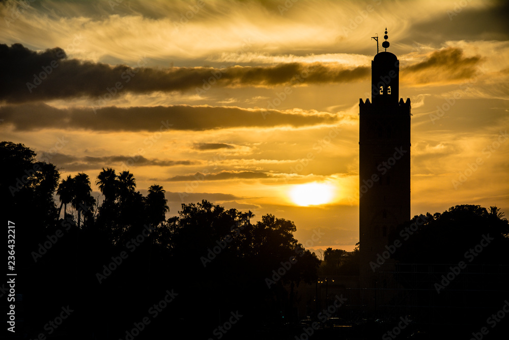 Marrakesh mosque in silhouette at sundown in Morocco