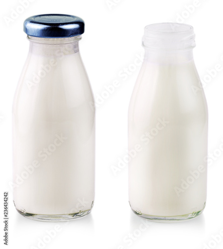 The glass bottles with milk with shadow isolated on white