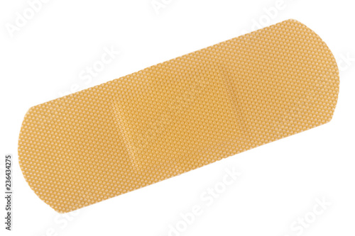 Top view of beige adhesive bandage on white