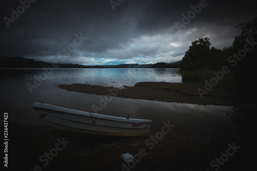 Boat by the lake shore Jonsvatnet lake, Norway.