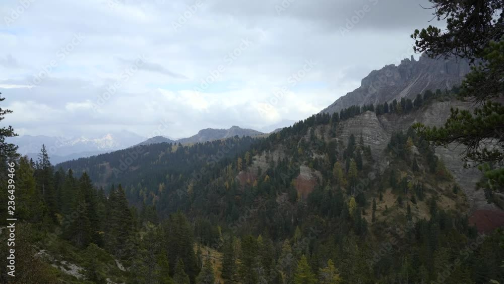 Colorful scenic view of majestic Dolomites mountains in Italian Alps. Majestic rocky mountains surrounded with yellow trees in autumn time. Colorful scenic view of majestic Dolomites mountains in Italian Alps. Majestic rocky mountains surrounded with yellow trees in autumn time.