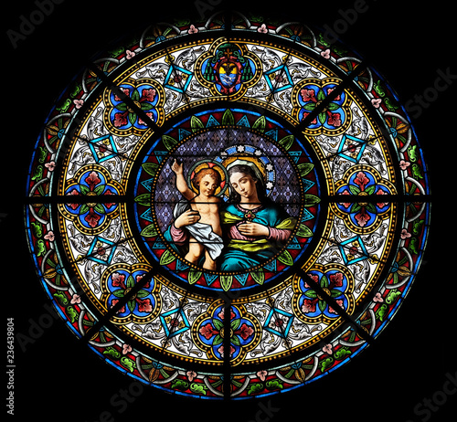 Virgin Mary with baby Jesus, stained glass window in the Cathedral of Saint Lawrence in Lugano, Switzerland