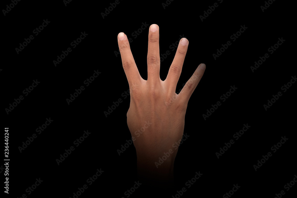 Male hand finger sign over dark background Male hand finger sign over dark background