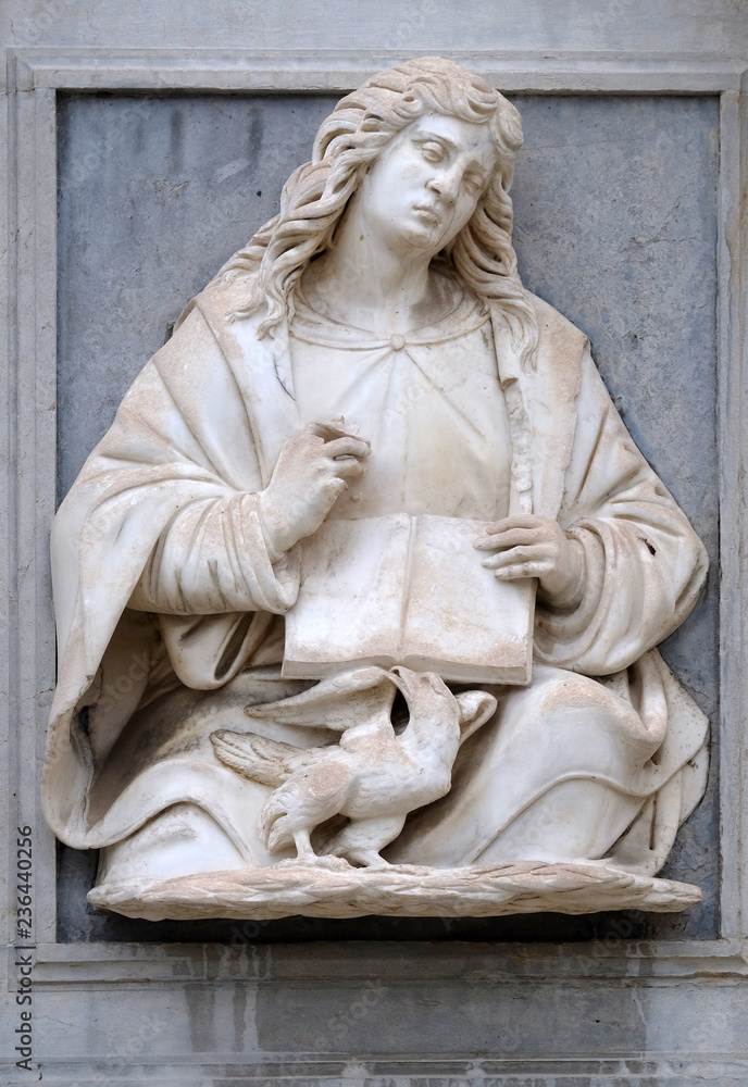 Obraz premium Saint John the Evangelist relief on the portal of the Cathedral of Saint Lawrence in Lugano, Switzerland