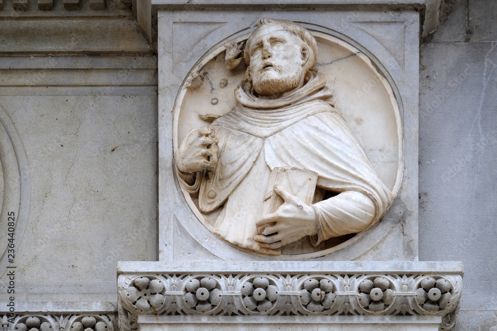 Saint, relief on the portal of the Cathedral of Saint Lawrence in Lugano, Switzerland