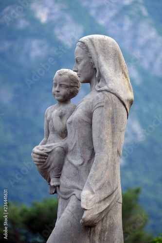 Virgin Mary with baby Jesus statue infront of the Cathedral of Saint Lawrence in Lugano, Switzerland