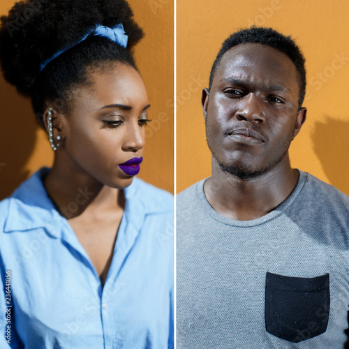African-American couple on the street on a yellow background
