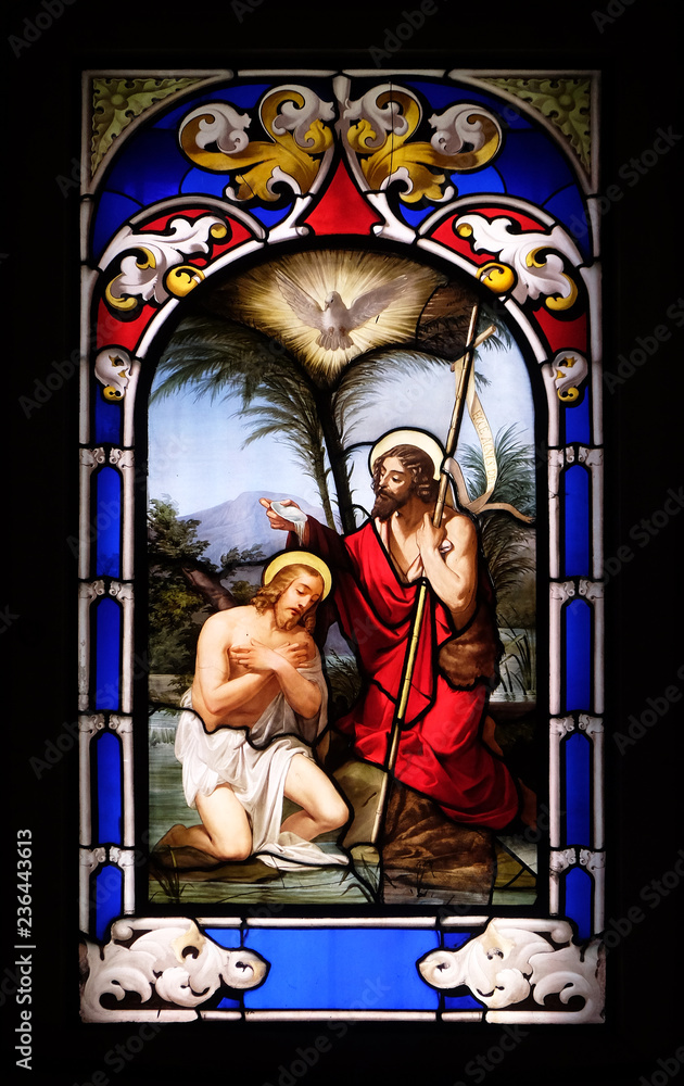 Baptism of the Lord, stained glass window in the Church of St. Ambrose and Theodulus, Stresa, Lago Maggiore, Piedmont, Italy