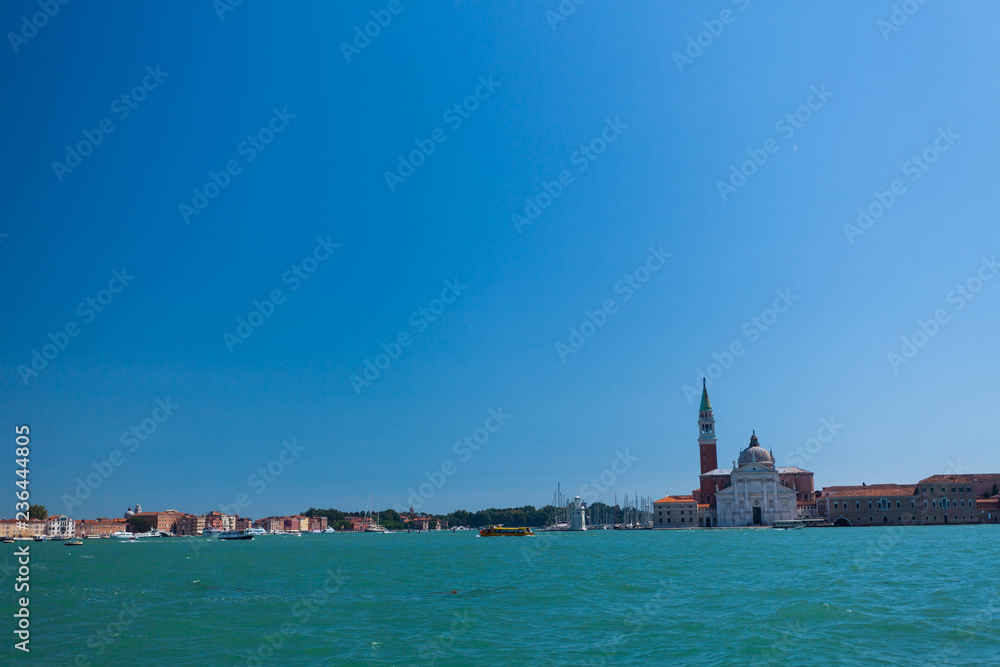 View of the San Giorgio Maggiore Temple and the lagoon on a sunny day.