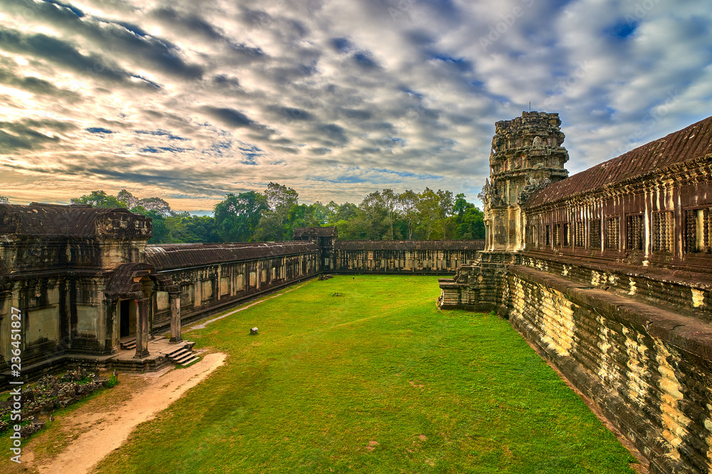 View of Angkor Wat complex at sunrise, Archaeological Park in Siem Reap, Cambodia, UNESCO World Heritage Site and popular tourist attraction