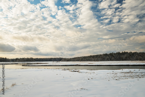 Winter landscape. River and forest in the background. USA. Maine. Portland.  