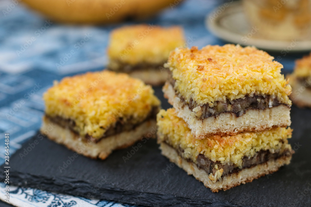 Banana cake with coconut flakes - festive dessert for Christmas, New Year, Close-up