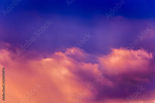 A multicolored bright sky with clouds during the sunrise or sunset_