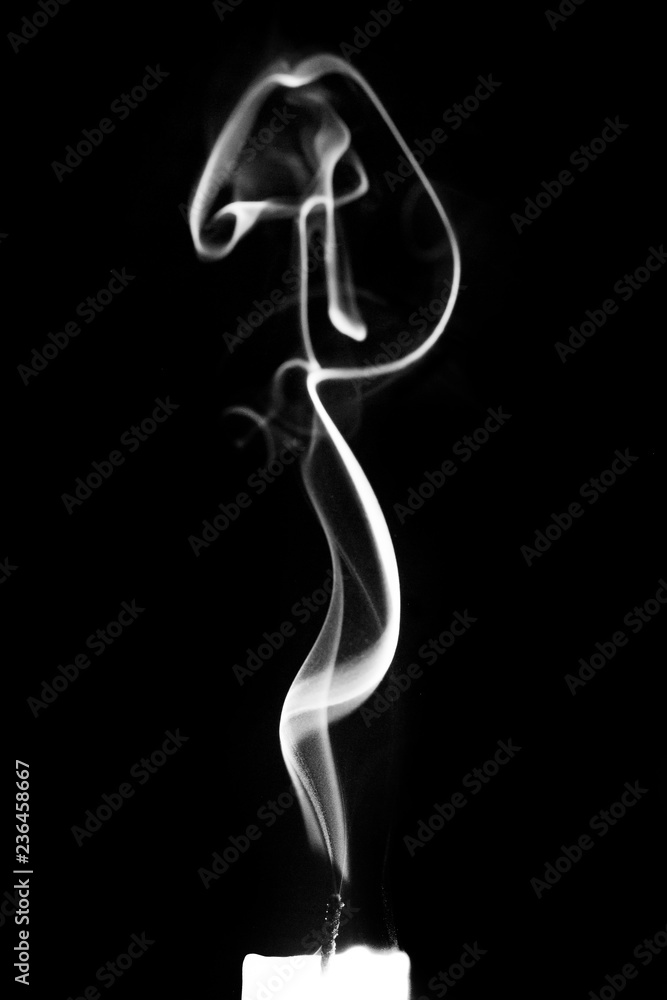 Smoke from a candle on a black isolated background. An interesting and  weird smoke pattern_ Stock-Foto | Adobe Stock