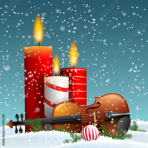 Christmas theme with violin and burning candles photo