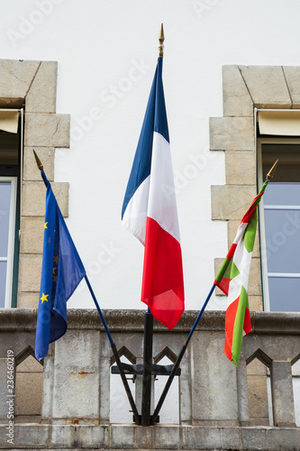 Basque country, France. Three flags on the administration building. Flags of France, of Basque country and of European Union.