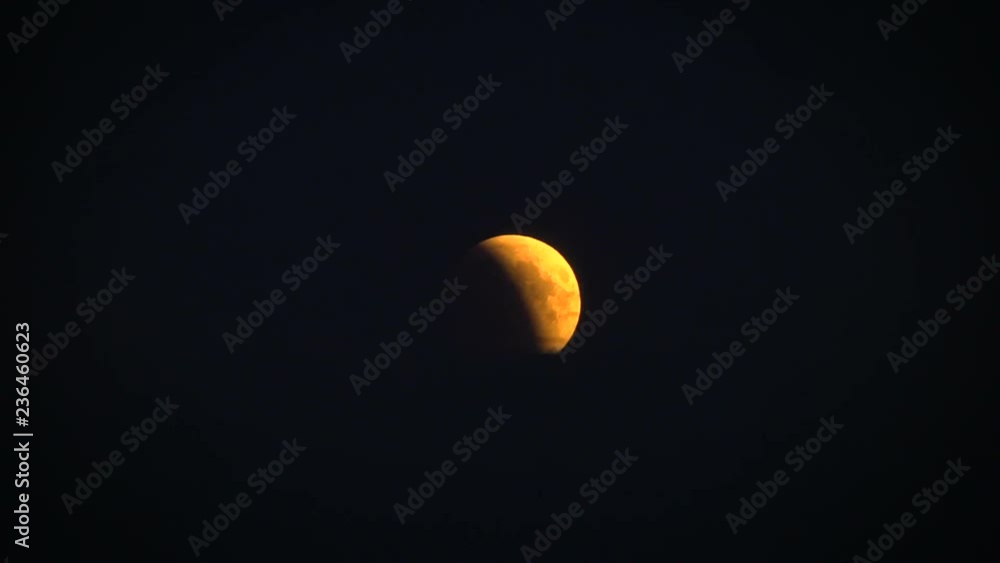 The incomplete bloody moon is hiding behind the clouds. The incomplete bloody moon is hiding behind the clouds.