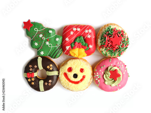 Top View of Many Colorful Christmas Decorated Doughnuts Sweets Isolated on White Background 