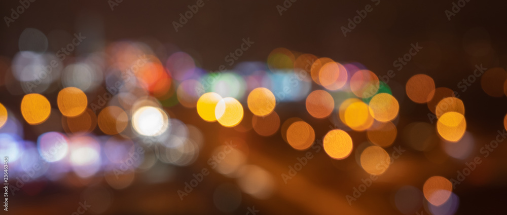defocus evening city background in colored lights