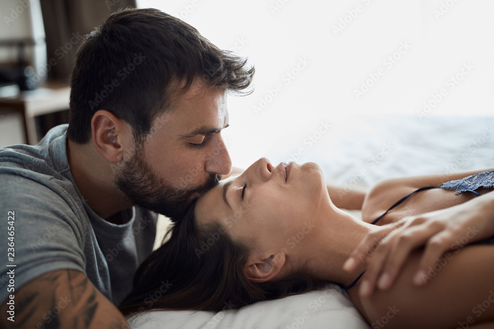Fototapeta premium Sexy couple being intimate in bed.