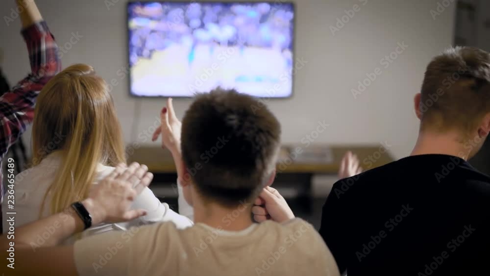 Young man and woman watching TV Young man and woman watching TV