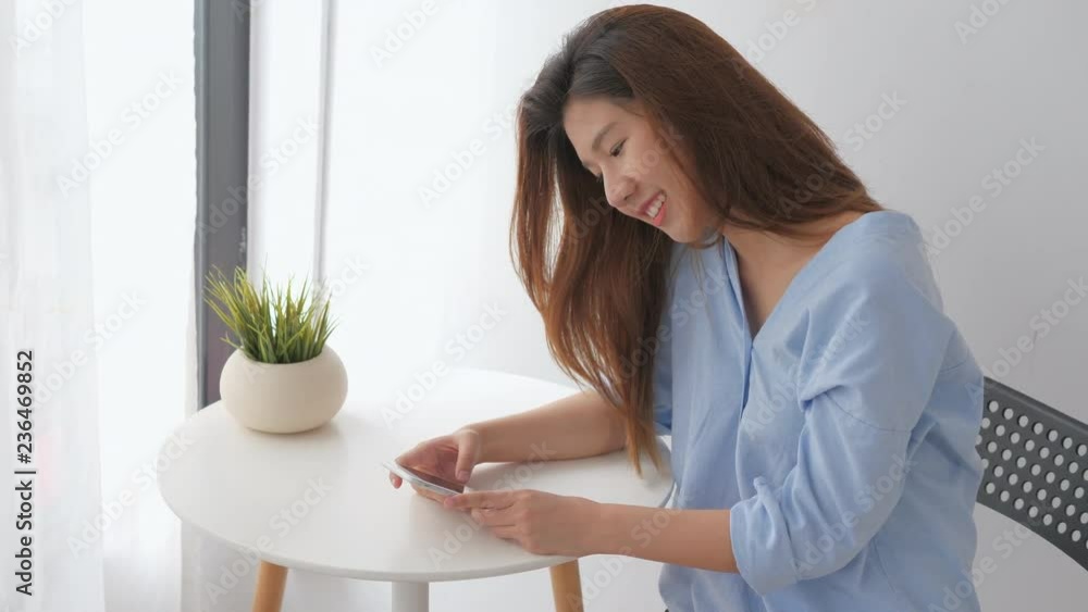 Young asian woman using smartphone in online society Young asian woman using smartphone in online society