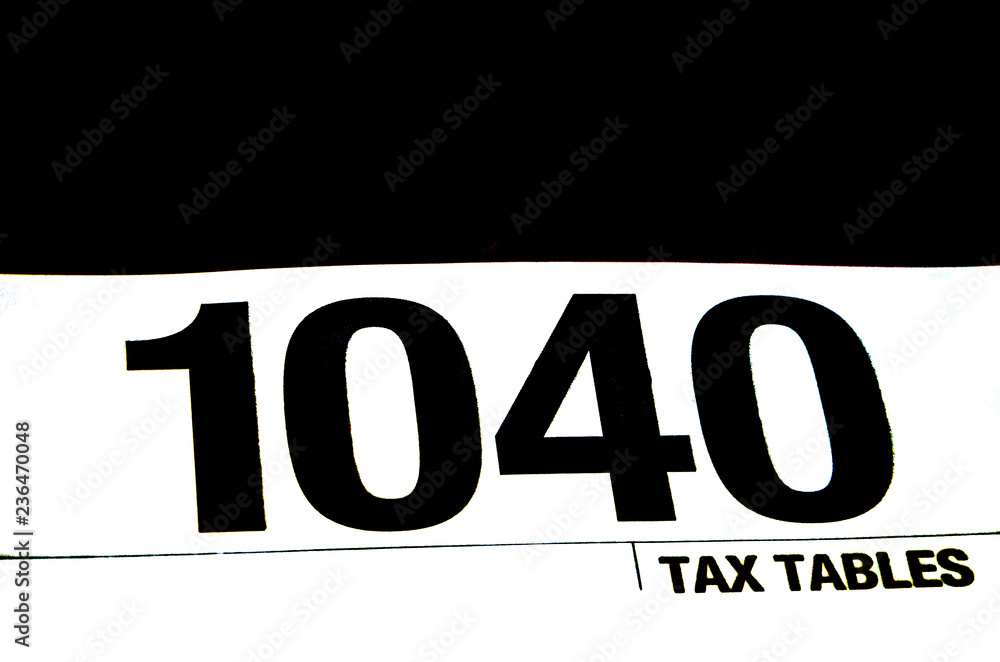 1040 tax form on a black background 1040 tax form on a black background