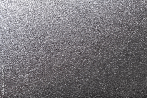 Textural of gray background of wavy corrugated paper, closeup.