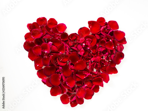 beautiful heart of red rose petals on white