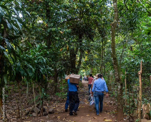 people bringing food and supplies to small village in Guatemala