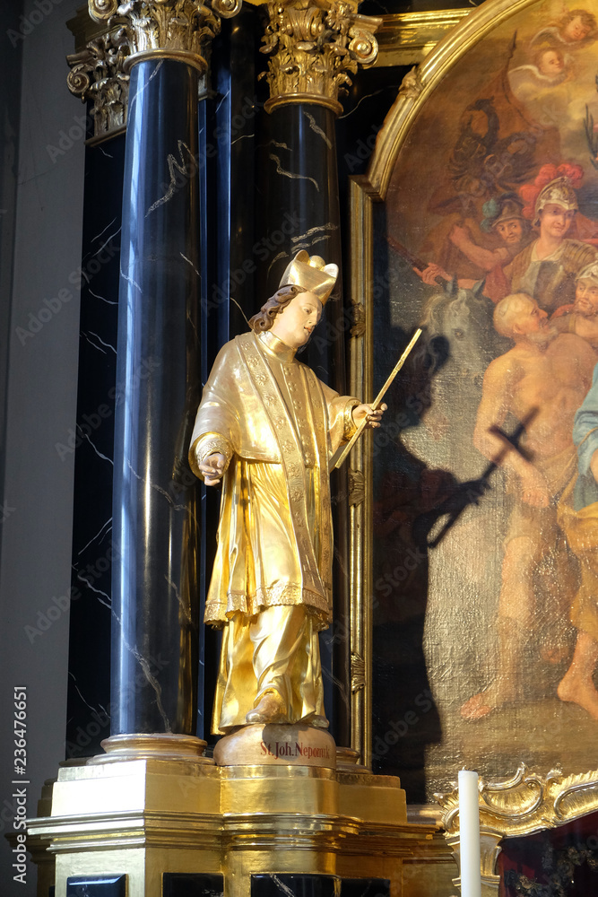Statue of Saint, statue on the Saint Peter and Paul altar in the Neumunster Collegiate Church in Wurzburg, Germany