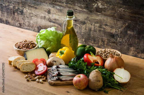 Fototapeta Naklejka Na Ścianę i Meble -  Healthy eating. Mediterranean diet. Fruit,vegetables, grain, nuts olive oil and fish on wooden table