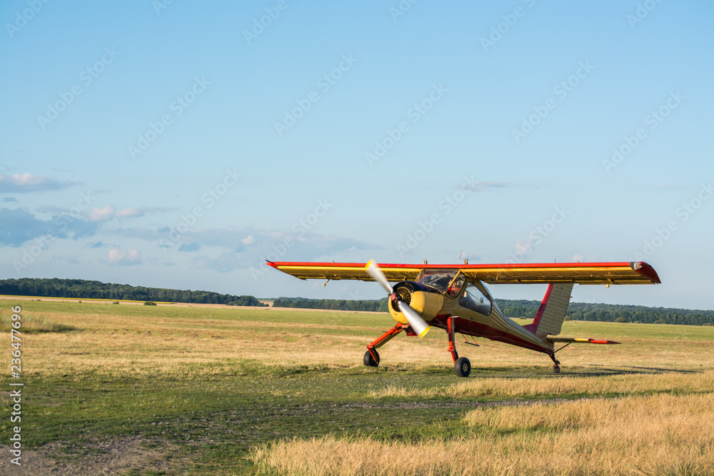 Sports light aircraft in the field landing takeoff Sports light aircraft in the field landing takeoff